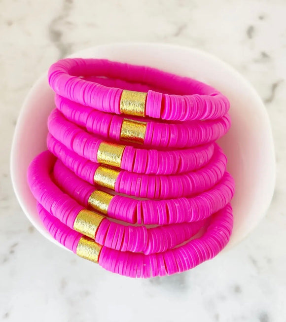 Hot pink bracelet with gold accent bead